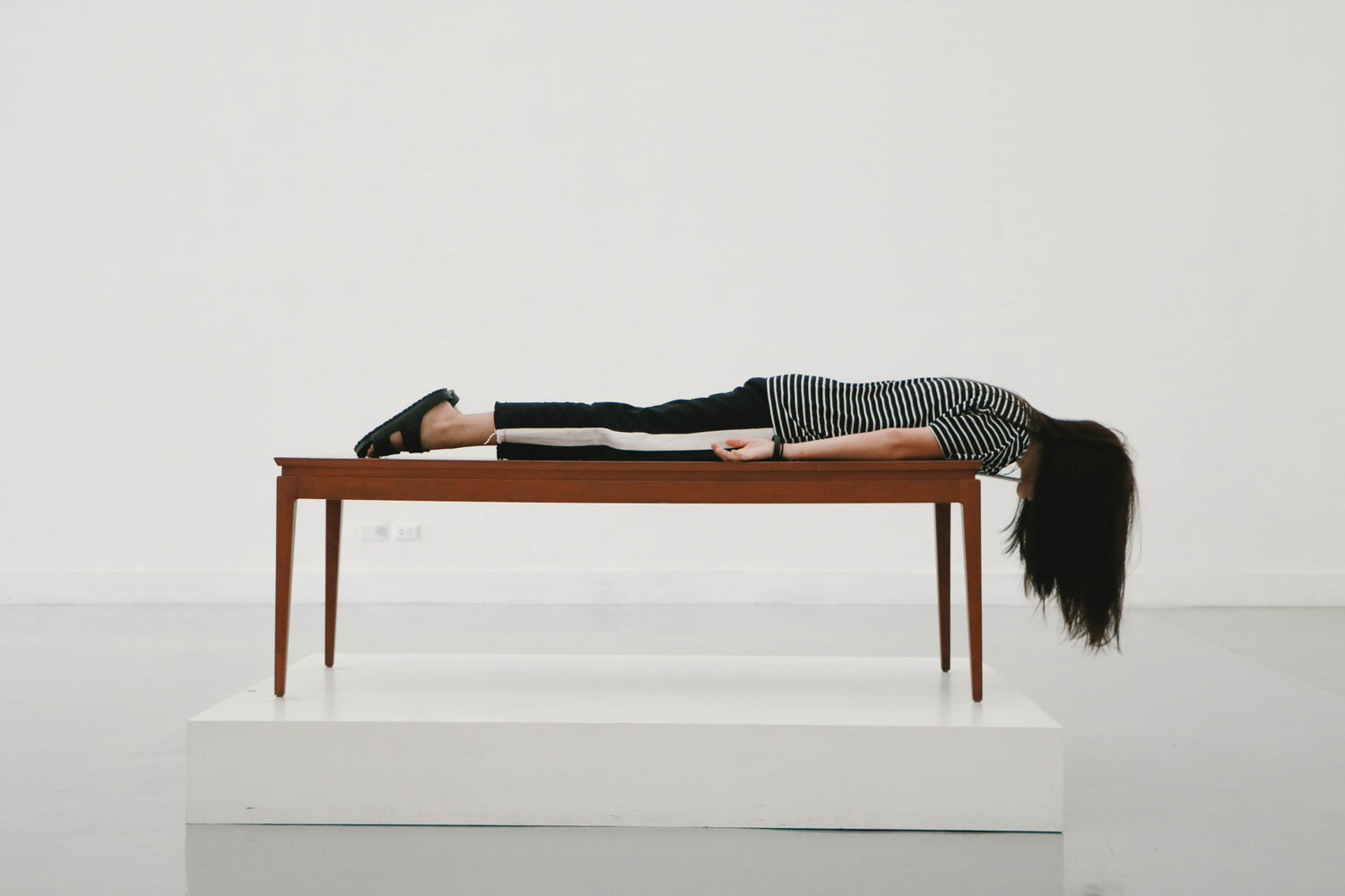 Woman lying face down across table. Energetic blocks, blocks, walls, energy healing, energy blocks, stuck energy, feeling stuck, emotional wounds, childhood, childhood trauma, 3 keys, 3 keys visionary art. 